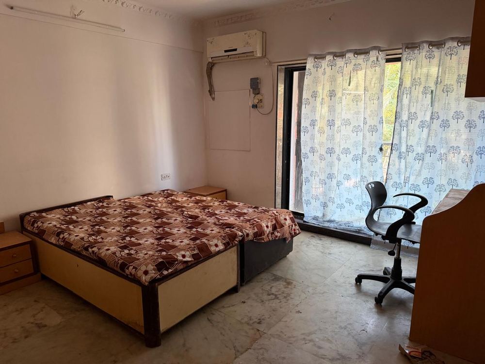 Double-sharing room at Preeti Vihar, Mumbai