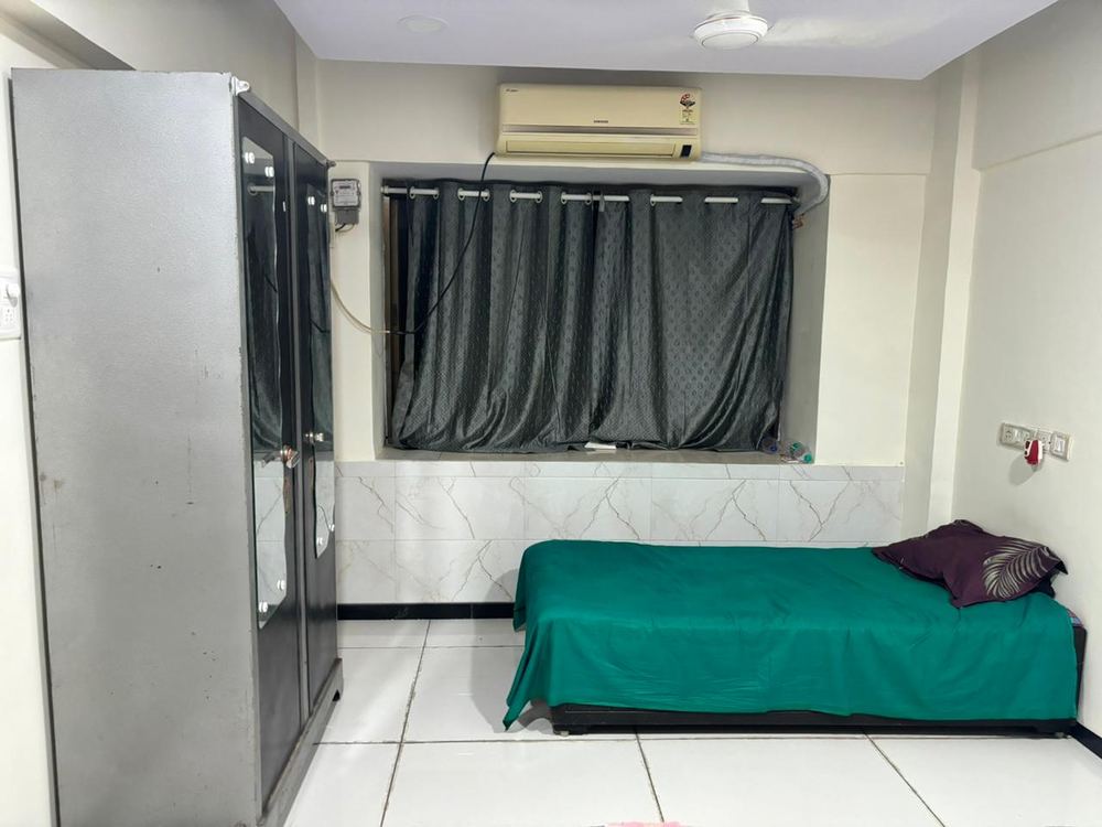 Single-sharing room at Gokul Monarch, Mumbai