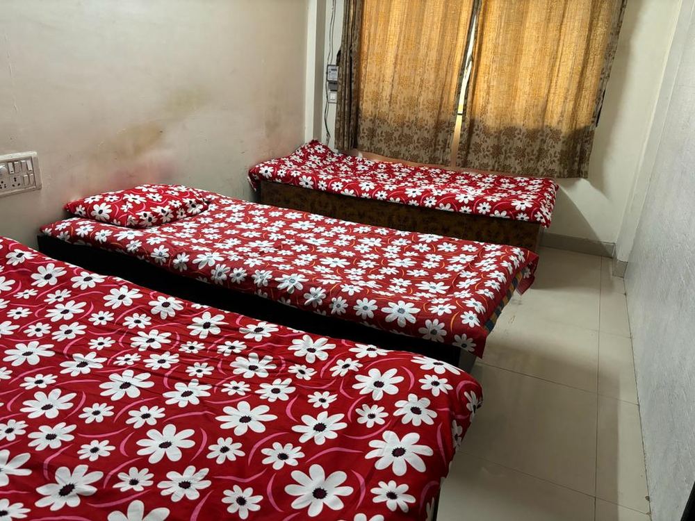 Triple-sharing room at Gokul Horizon, Mumbai